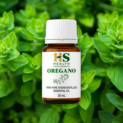 Oregano essential oil bottle with green leaves in the background
